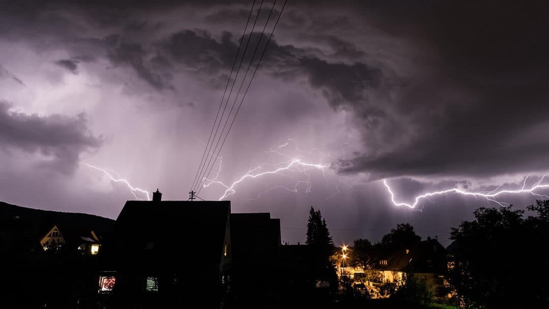 Lightning striking near a home