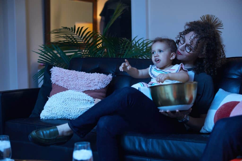 Mom and Child Watching Television Connected with Coax Cable