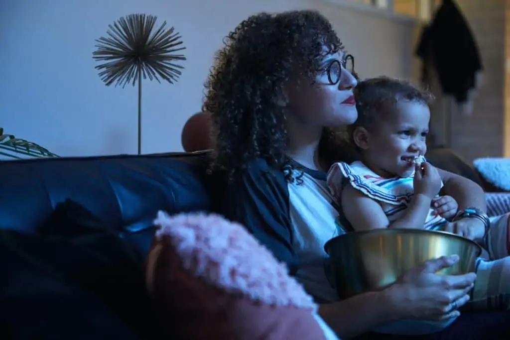 Family watching a movie on their av system