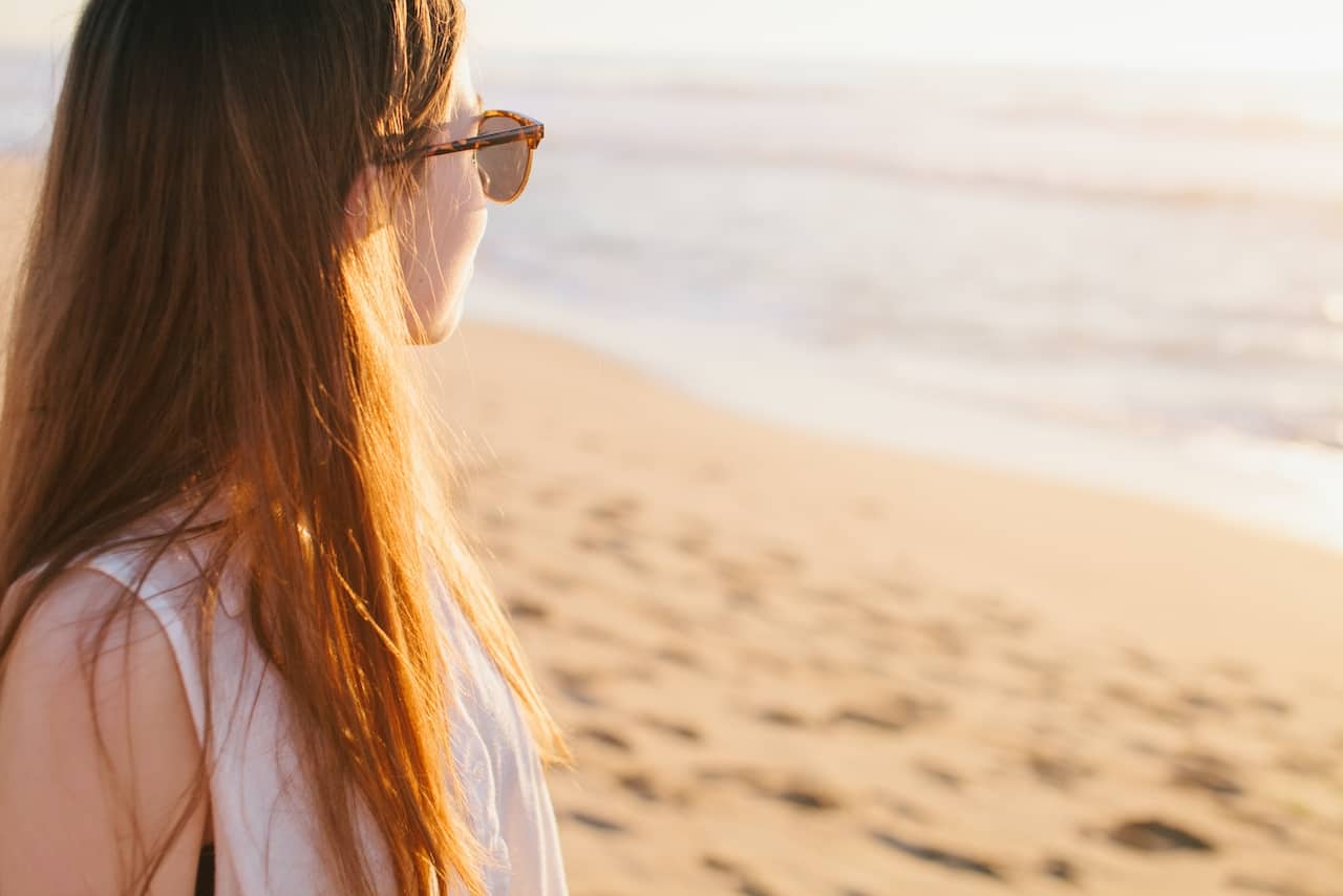 Picture of a woman on a beach during vacation